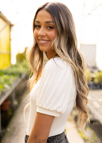 Side view of a ivory bodysuit