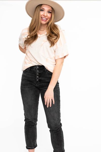 Oatmeal top with peach stripe trim on cuffs and the sides
